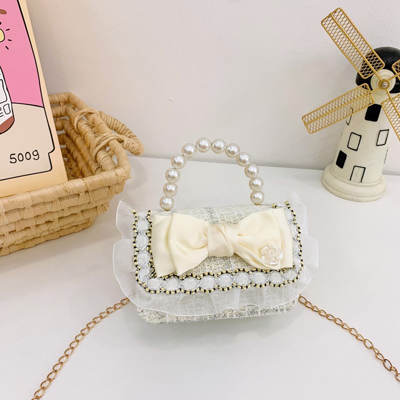 Bolsa de hombro coreana para niñas, arco de perlas, lindas flores, bolso de mochila para bebés, nuevo tipo de bolso para niños fragante.
