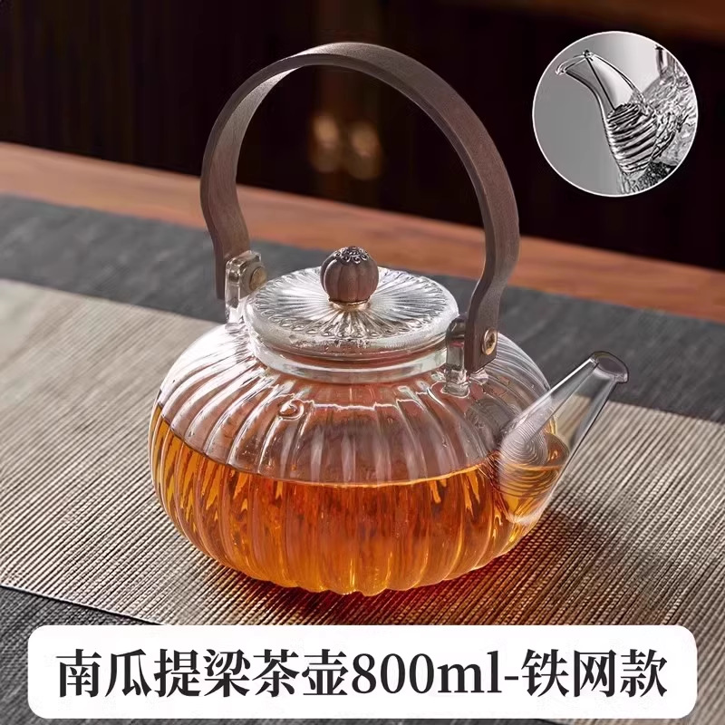 Venta directa de fábrica Tetera de vidrio con alto contenido de borosilicato Tetera de espuma con patrón de martillo de viga de elevación de metal Tetera de vidrio de alta calidad para el hogar