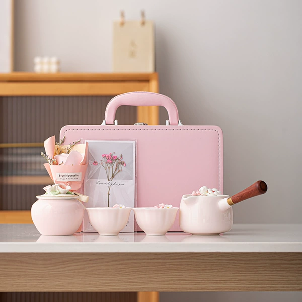 Pink side handle, one pot, two cups + tea can [leather bag]