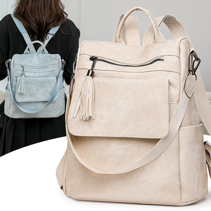 Nuevo estilo mochila mujer 2024 de gran capacidad retro moda borla bandolera viaje de ocio mochila ligera al por mayor