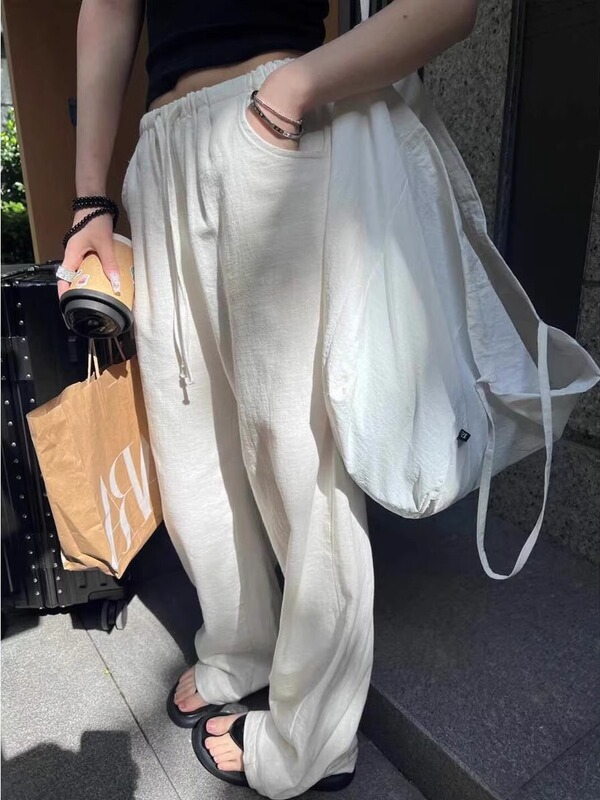 亜麻のワイドパンツの女性の夏の薄いタイプの高腰の垂れ下がった感がゆったりしていて、やせています。|undefined