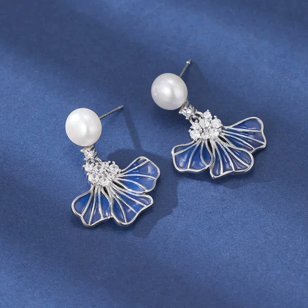 Light luxury design, gradient-colored enamel blue petal earrings, elegant and versatile, featuring natural freshwater pearls