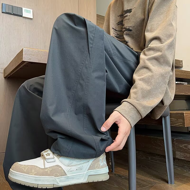 Marca de moda americana de piernas largas sueltas pantalones largos casuales para hombres nuevos pantalones de paracaídas de otoño rectos pantalones de trabajo versátiles