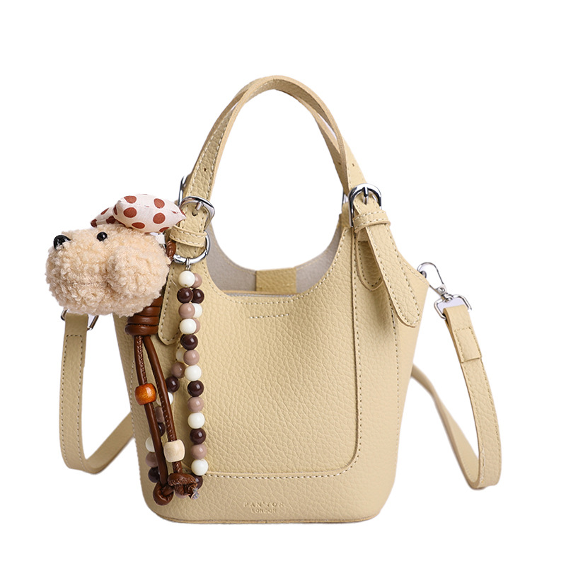 2026 nueva moda versátil cesta de verduras portátil bolso de cubo de agua de alta calidad litchi patrón ligero bolso de lujo bolso de mochila