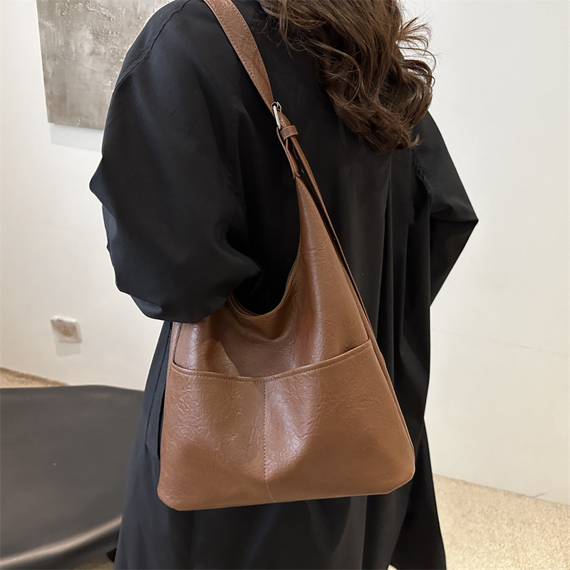 Bolso de mujer 2024, nuevo otoño y invierno de alta calidad, bolso de brazo de viaje simple, bolso de hombro de gran capacidad para mujeres.