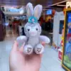 Purple rabbit sitting pose with paws