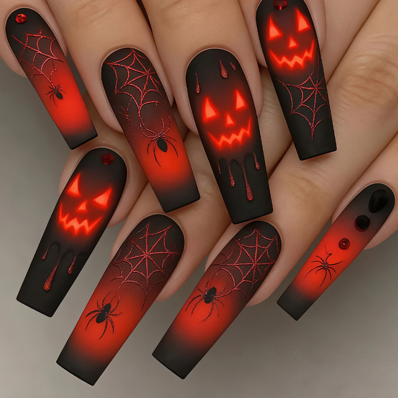 Halloween nail art with red ghost faces, pumpkins, black spiders, blood drops, red-black gradient, wearable nail art, high-end boutique Halloween nail art with red ghost faces, pumpkins, black spiders, blood drops, red-black gradient, wearable nail art, high-end boutique