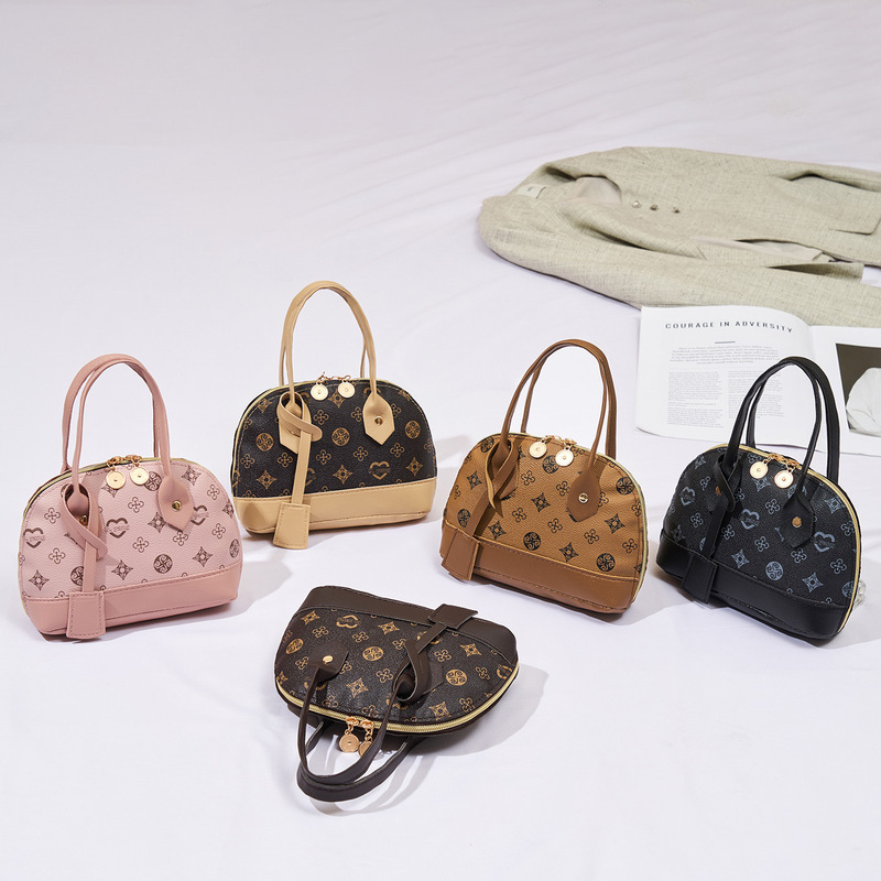 2026 New Fashion Light Luxury Niche Monica Chic High-End Women's Handbag with Printed Contrasting Color Shell Design