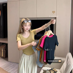 百合の肩の半袖のtシャツの女性の春の夏のu襟の修身はやせています。