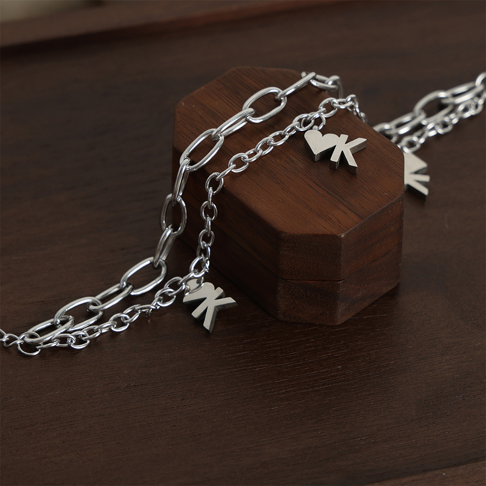 Chino antiguo estilo nicho personalidad Cadena de doble capa cadena apilada estilo diseño amor OK colgante titanio pulsera de acero al por mayor hembra