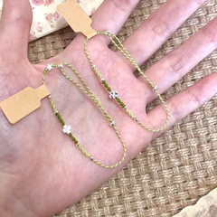 春の緑の四つ葉のクローバーのブレスレットの女性insの小さい大衆のファッションの女性の蜜の手の縄の森は百合の田園風の甘い贈り物を結びます。