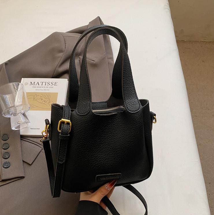 Bolsa de mano ocio transfronteriza versátil para mujeres 2025 nuevo estilo popular retro bolso de cubo de alta calidad simple mochila