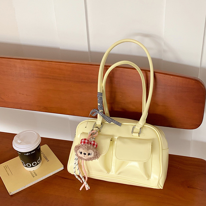 La moda coreana de nicho de estilo extranjero bolsas de palos debajo de las axilas para mujeres 2026 primavera nueva bolsa diaria de Boston bolsas de bolos