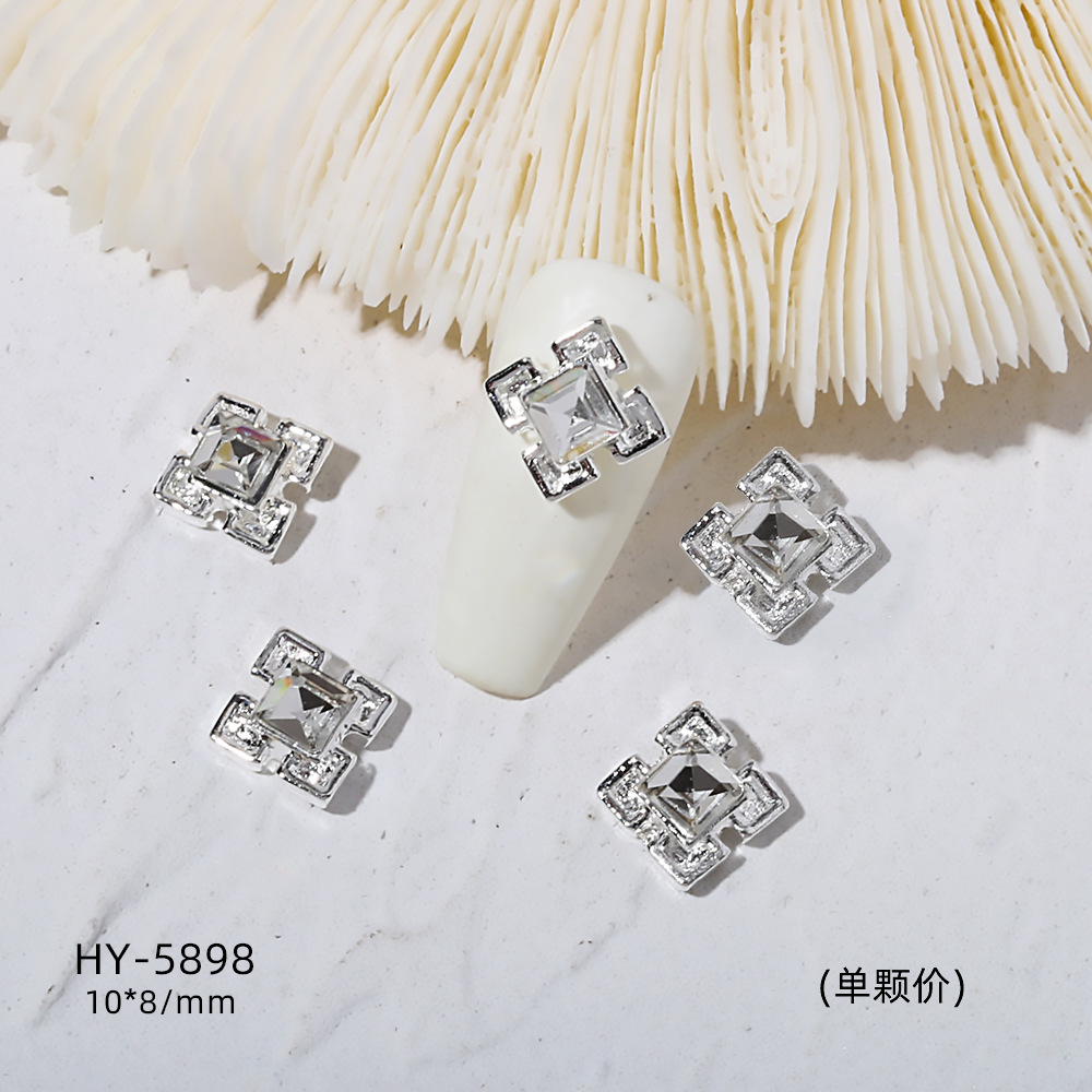 Venta caliente taladro de uñas arco de plata joyería tridimensional flash diamante esmalte de uñas decorativo diamante acabado pieza de uñas traje de joyería