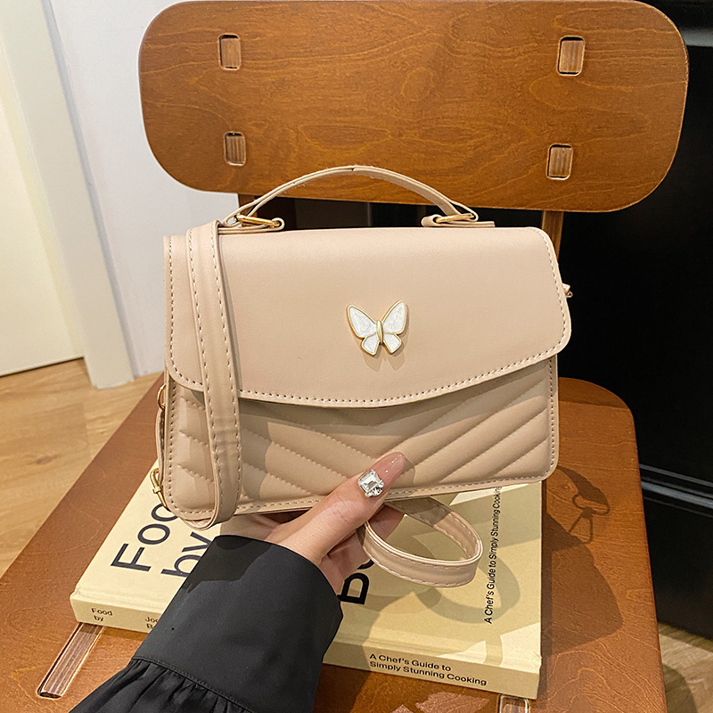 Bolso bordado de color sólido otoño y invierno 2024 nuevo estilo retro bolso de moda simple bolso de mariposa de moda