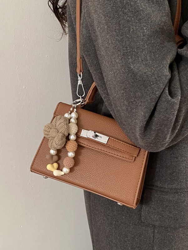 Bolso de mano de alta sensación para mujeres 2026 nuevo retro lichi Kelly bolso nicho lujoso mochila de hombro