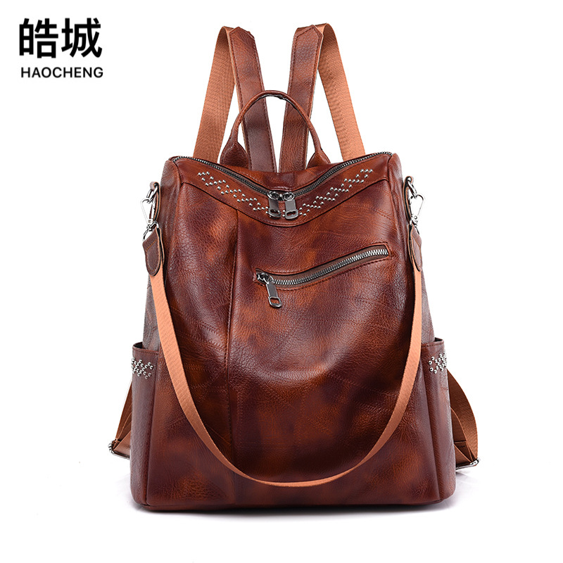 2023 verano coreano casual mujer PU mochila moda remache simple de gran capacidad multifunción mochila antirrobo