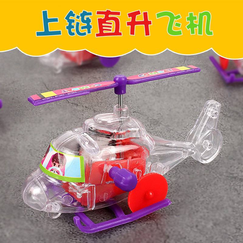 New wind-up transparent toy airplane/helicopter with rotating propeller - wholesale.