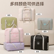 跨境飞机旅行包纯色大手提圆标拉杆包折叠旅行包衣物收纳袋便携袋