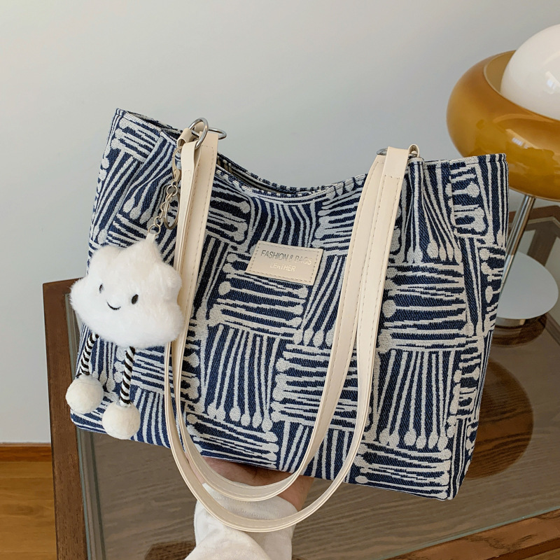 Bolsa multipropósito coreana de hombro de mujer, nicho de diseño de textura portátil, bolso de hombro de mujer, pequeño bolso fresco.