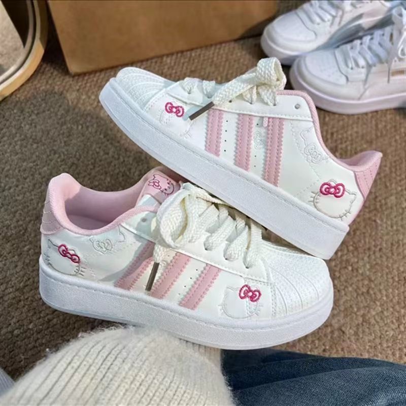 2026 primavera nuevo polvo blanco gato zapatos de pan de cabeza de concha de mujer estilo de escuela zapatos de skate de nicho zapatos deportivos bajos