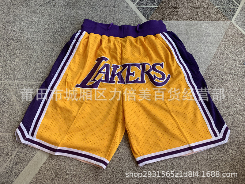 Comercio exterior pantalones de fútbol al por mayor Warriors Lakers 76 caliente Raptor mágico bolsillo bordado pantalones cortos pantalones de baloncesto NFL
