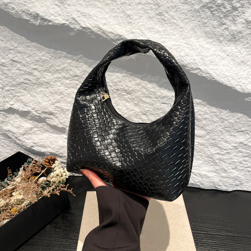 Bolsa de tejido francesa de alto nivel para mujeres 2025 nuevo bolso de bolsillo de nicho de textura de bolso de viaje de bolso de mano universal