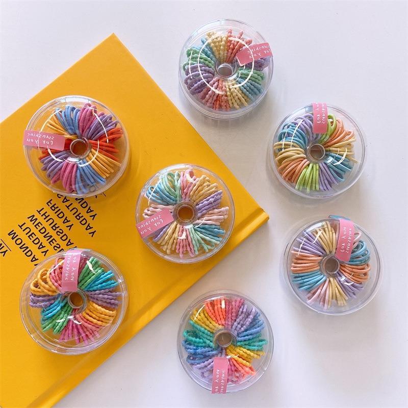 Nuevo color fluorescente de los niños anillo de pelo pulgar 60 caja redonda banda de goma nuevo anillo pequeño no duele traje de pelo