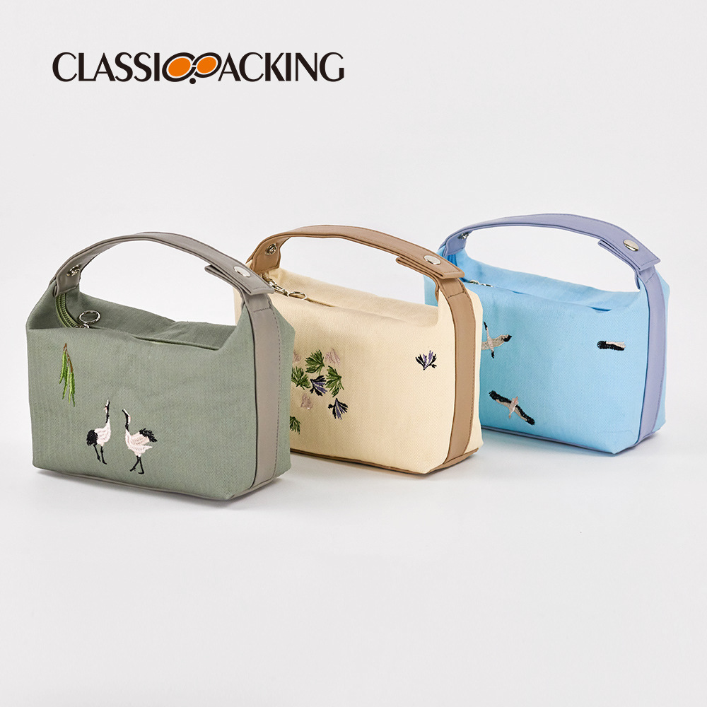 Bolso de mano cosmético de estilo nacional con LOGOTIPO impreso Bolso de lona de alta apariencia portátil del todo-fósforo del arte del bordado