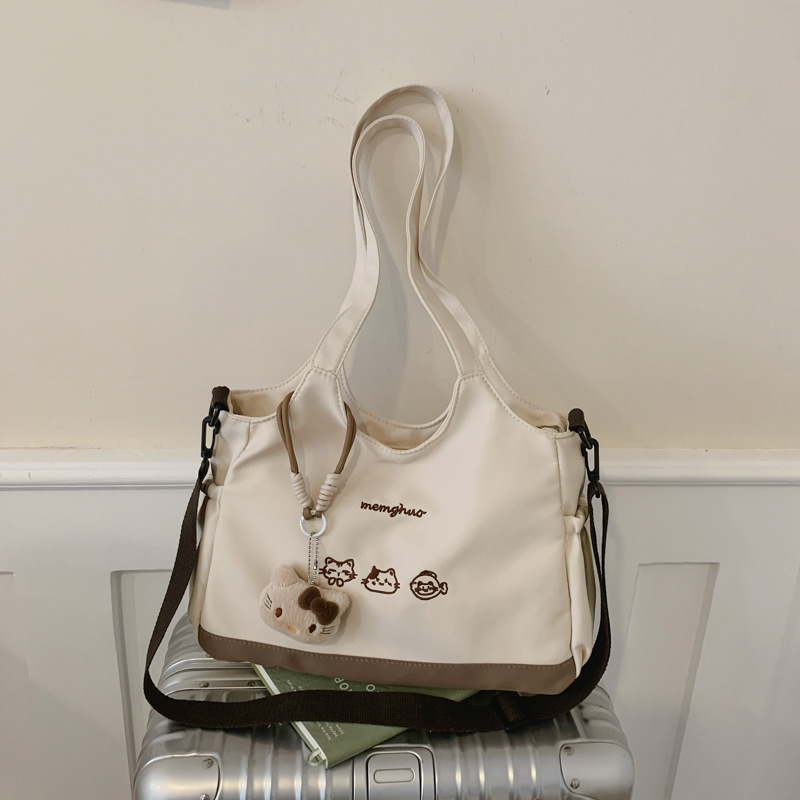 2026 nuevo lindo bolso de tote nicho de moda simple textura de viaje universal mujer gran capacidad mochila de hombro