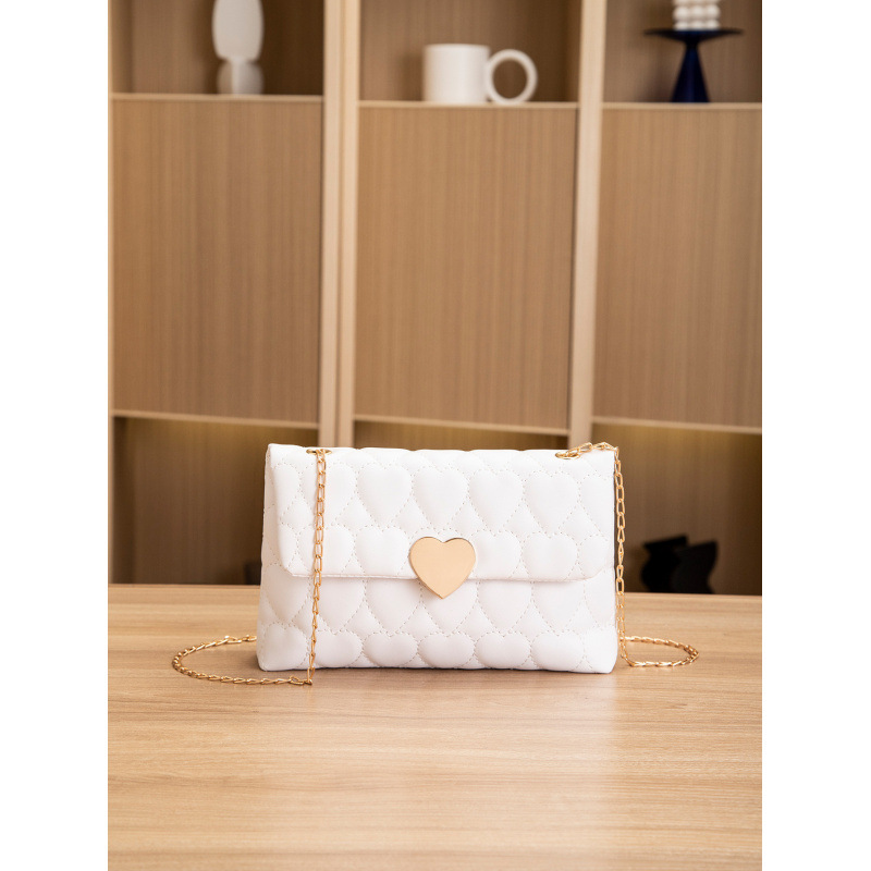 Bolsa de hombro de cerradura de corazón de melocotón comercio exterior al por mayor 2025 primavera y verano nuevo bolso multifuncional de mujer, bolso de mujer interior