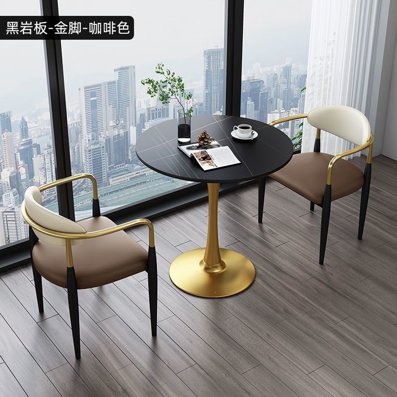 Gold legs + black rock slab + brown leather, one table and two chairs