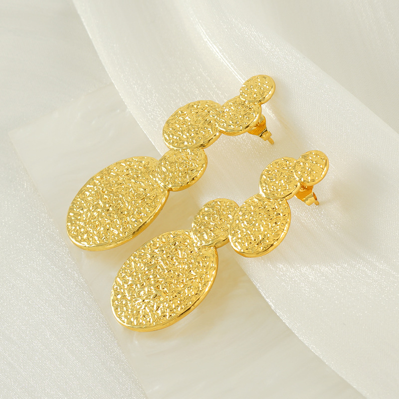 Diseño transfronterizo europeo y americano, pendientes de acero de titanio de moda chapados en oro de 18 quilates de acero inoxidable de lava INS viento