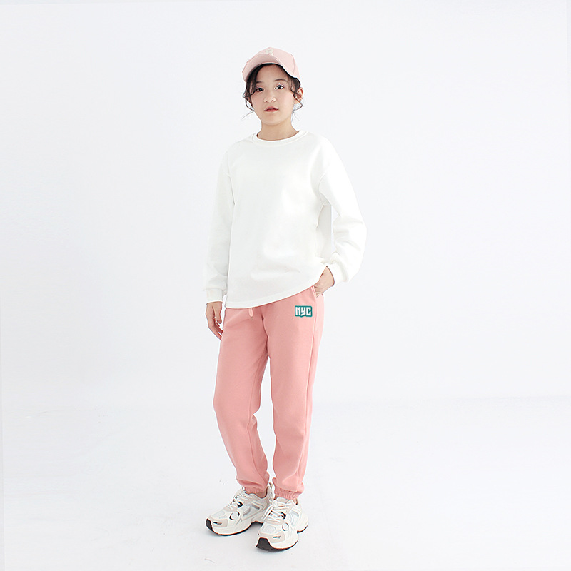 Pantalones de invierno para niños estilo coreano nuevos Pantalones deportivos engrosados para niños medianos y grandes pantalones de niñas calientes forrados de lana al por mayor