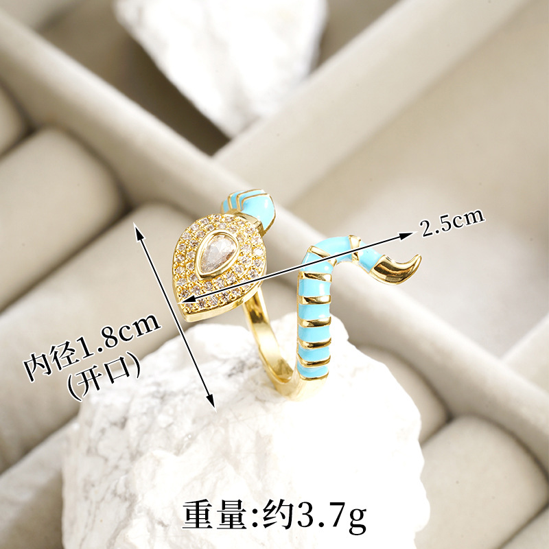 Brazalete de oro galvanizado de arena transfronteriza de 18k esmalte de color universal cabeza de serpiente de micro-pantalón anillo de piedra abierto joyas de estilo europeo y americano