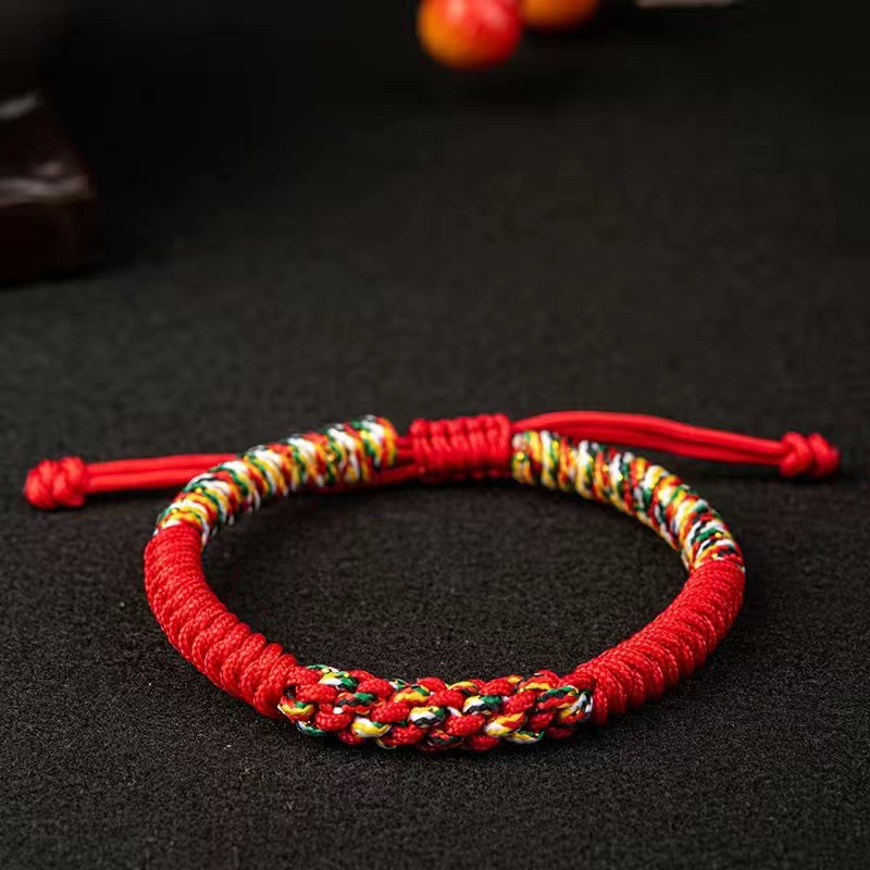Pulsera de nudo de diamante Ruyi estilo étnico pareja regalo tirón tejido a mano año de nacimiento pulsera de cuerda roja hombres y mujeres