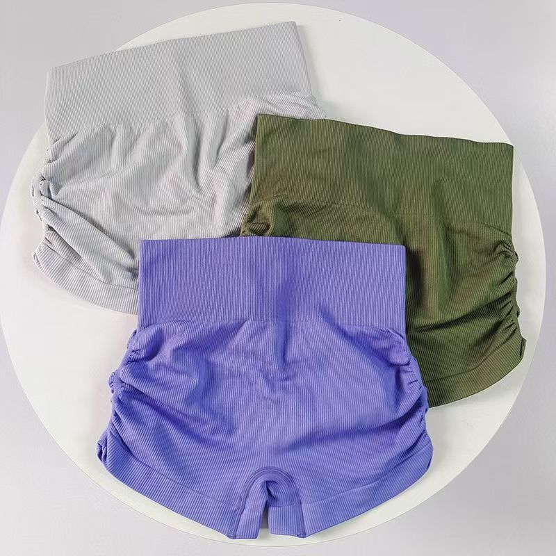 Europa y América Pantalones laterales plegados de tres partes de mujer cintura alta sin costuras pantalones cortos deportivos apretados pantalones de gimnasio transpirables de alta elasticidad