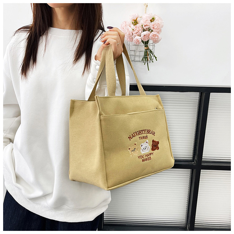 New wholesale fashionable and high-quality canvas handbag, simple and portable, easy to carry for going out, versatile lunch box and bento bag undefined