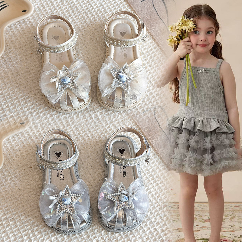 Niñas sandalias Baotou 2026 verano nuevo estilo de moda infantil sandalias versátiles diamante estrella malla princesa zapatos de moda