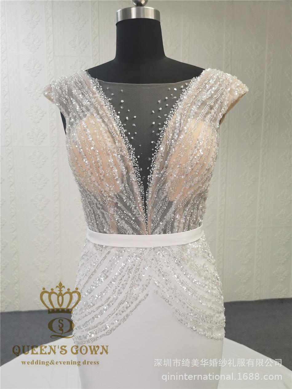 Long elegant beige wedding dress sleevless