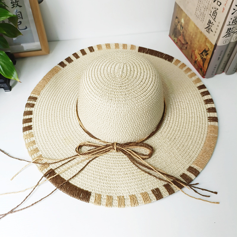 Gran sombrero sombrero de paja primavera y verano vacaciones de mar sombrero de sol damas moda para cubrir la cara arco sombrero solar al por mayor