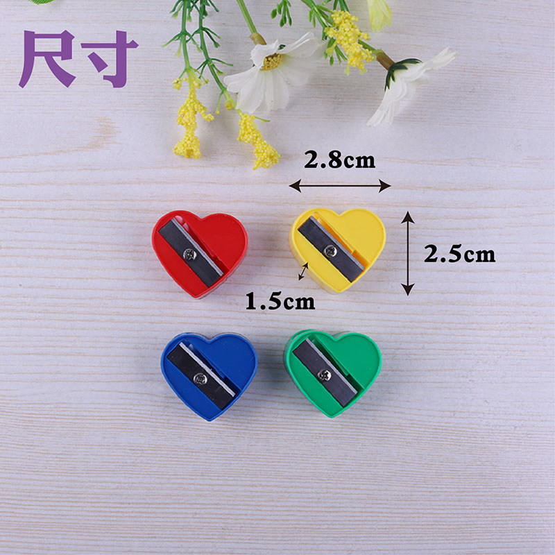 Sacapuntas de lápiz de un solo agujero en forma de corazón Sacapuntas de dibujos animados mini Sacapuntas de lápiz estudiante de la escuela primaria suministros de papelería ventas directas de fábrica