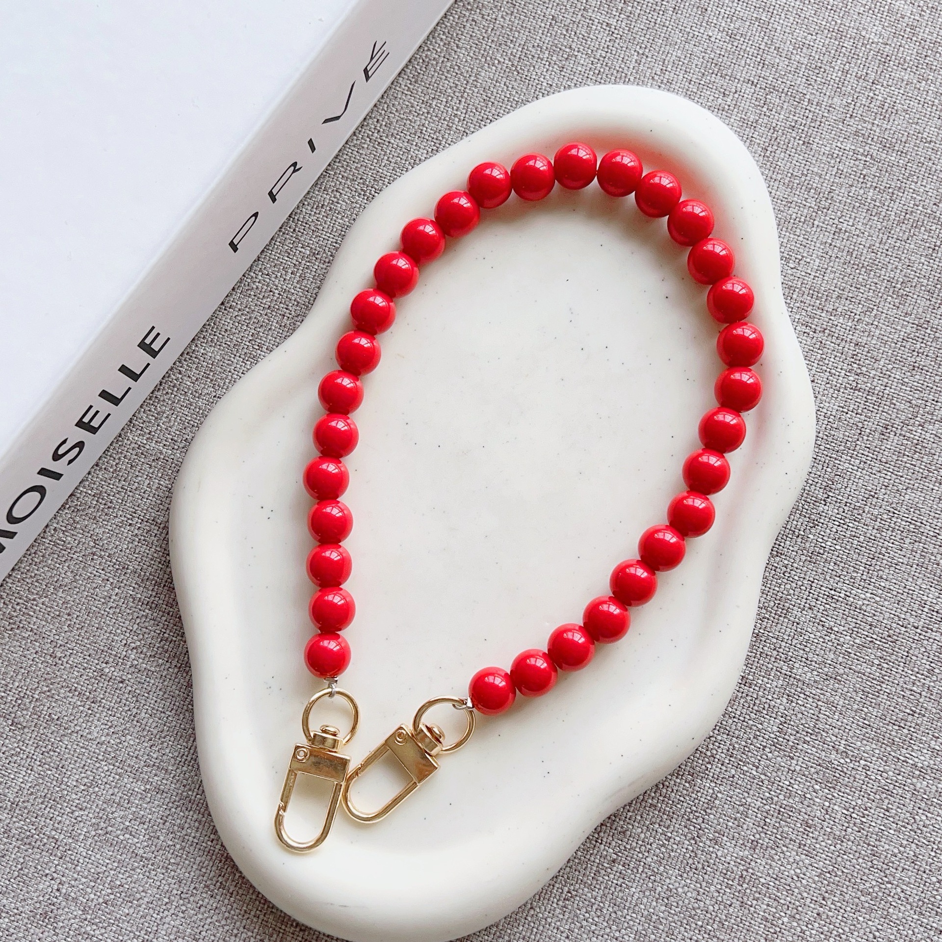 Nuevo estilo japonés y coreano cadena de cuentas de color sólido pulsera corta llavero bolsa de accesorios de cadena de perlas de todo fósforo cordón transfronterizo