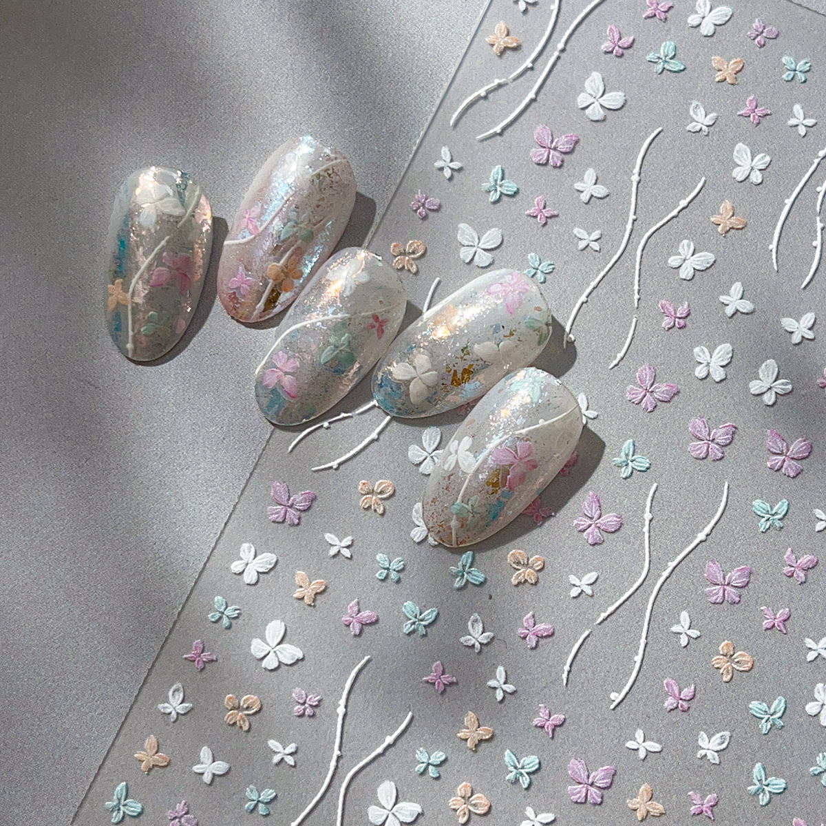 Pegatinas de mariposa de uñas nuevo estilo tridimensional pintado a mano arco de color en relieve exquisito pegamento para uñas decoraciones al por mayor