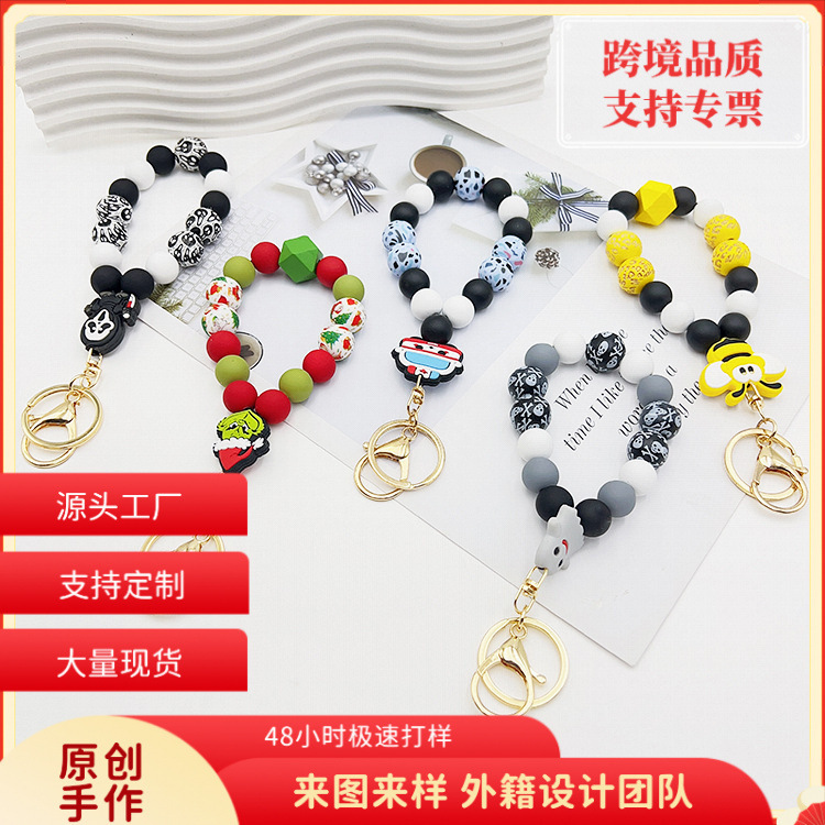 Creative cross-border European and American hot selling silicone pumpkin cow ghost dog claw wooden beads bracelet keychain bracelet key ring