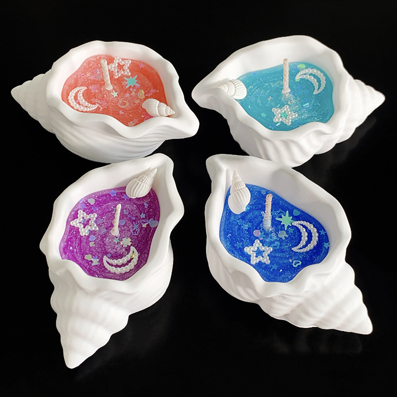 Doftljus formad som snäcka i presentförpackning för stämning_voghion.com