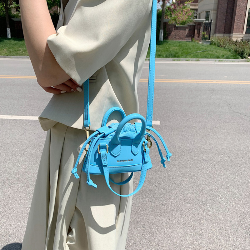 2022 Otoño e Invierno Nueva textura de los niños bolso de mano de moda europea y americana mini bolso de la cáscara transfronteriza bolsa de las mujeres