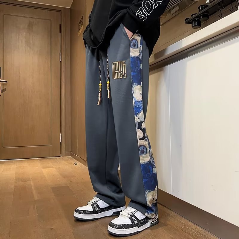 Pantalones de oso de marea nacional de primavera y otoño de los hombres marca de moda recta suelta pierna ancha 2025 nueva tendencia pantalones casuales de todo fósforo