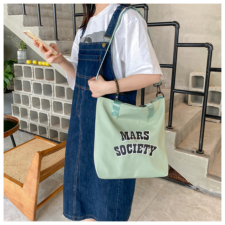 Canvas bag for women, single shoulder, ins crossbody, laid-back style, college student class bag, artistic Japanese style, large capacity, Hong Kong style, chic undefined