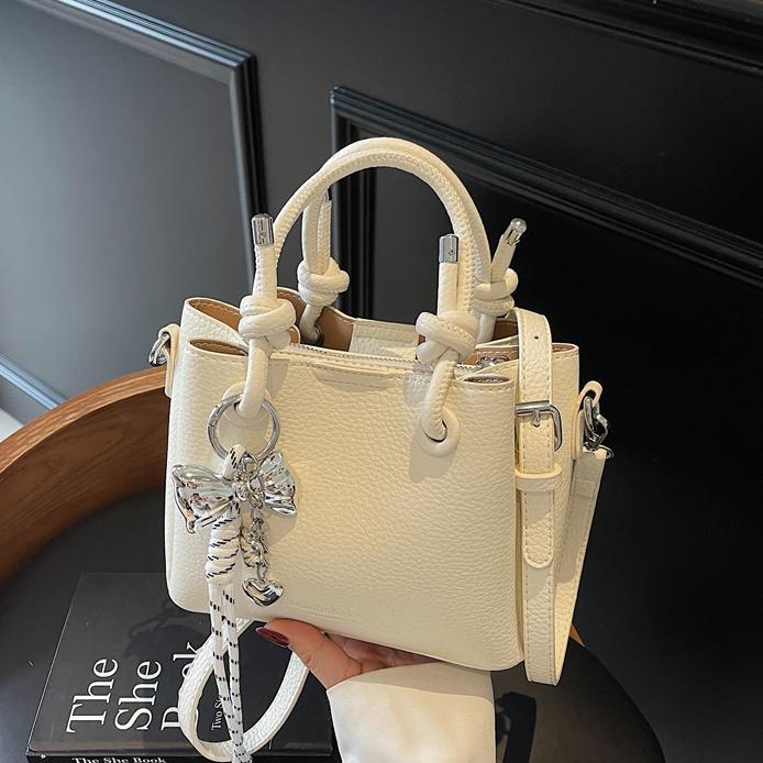 Bolso de mano de estilo explosivo de comercio exterior para mujer 2025 nuevo bolso de hombro casual simple bolso de cubo de sentido avanzado de moda salvaje